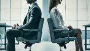 business man and woman are sitting back to back